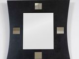 a close up of a square mirror hanging on a wall