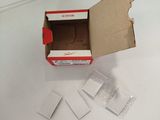a box with a piece of paper in it on a table