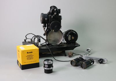 a black and white photo of a camera and some other items