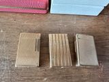 four different types of lighters sitting on a table next to each other