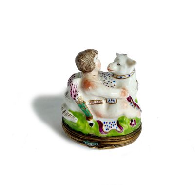 a figurine of a woman and a dog on a plate