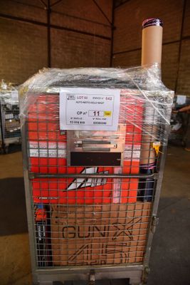 a cart that has a bunch of boxes in it