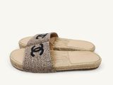 a close up of a pair of slippers with a logo on them