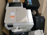a box with a printer, printer and other items in it