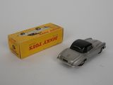 a close up of a toy car next to a box on a table