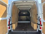the back of a white van with its doors open and the back door open