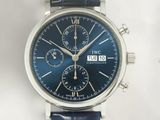 a close up of a wrist watch with a blue dial