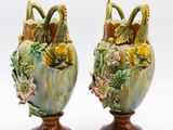 two vases that have been decorated with flowers on them