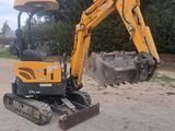 a small excavator that is sitting in the dirt
