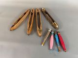 five pairs of scissors that are sitting on a table