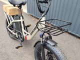 a bicycle with a basket on the front of it