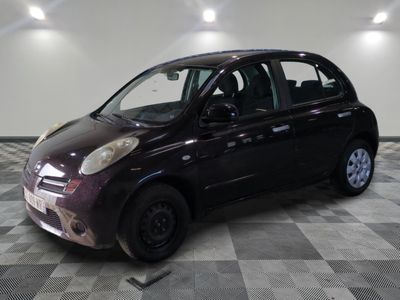 a picture of a small car parked in a garage