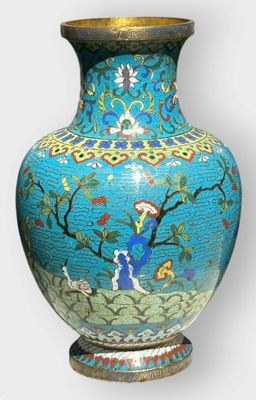 a blue vase with a picture of a woman in a garden on it