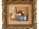 une vieille photo d'une famille de quatre personnes assises dans une pièce