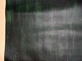 an image of a black and white photo of a green and black painting