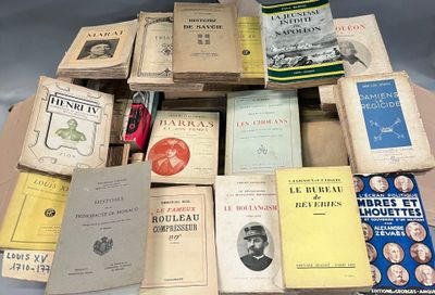 a lot of old books on a table together
