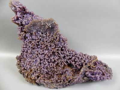 purple crystals on a white surface with a white background
