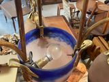 a blue bowl sitting on top of a wooden table