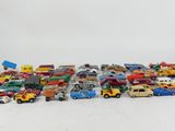 a lot of toy cars that are sitting on the floor