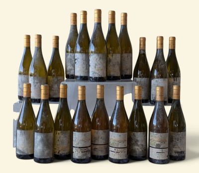 bottles of wine are arranged in a pyramid on a table