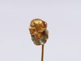 a small statue of a woman on a stick