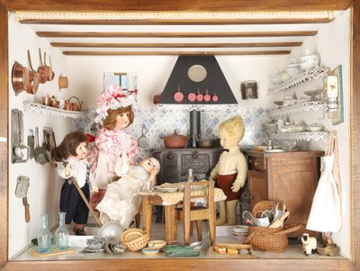 a doll house with dolls in it and a teddy bear in it