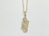 a gold necklace with a snake on it