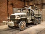 a old military truck parked in a garage