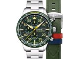 une photo d'une montre avec un cadran vert et un bracelet rouge et bleu