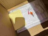 a cardboard box with a piece of paper inside of it