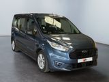 the blue van is parked in a room with a white wall
