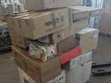 many boxes stacked on top of each other in a warehouse