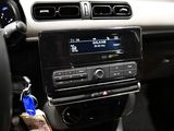 a car dashboard with a radio and a key in it