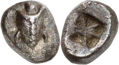 an image of a pair of silver coins on a white surface