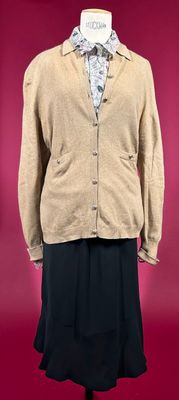 an image of a woman ' s jacket and skirt on a mannequin
