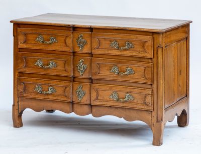 an image of a wooden chest of drawers with a marble top
