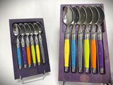 a set of spoons and spoon spoons in a wooden box