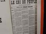 an open book with a black and white image of a newspaper