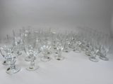 a lot of empty wine glasses sitting on a table