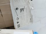 a person that is putting a piece of paper on a box