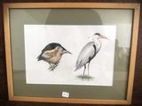 a picture of two birds that are standing next to each other