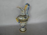 a blue and white vase with a bird on it
