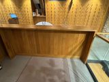a wooden desk with a laptop on top of it
