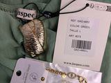a green shirt with a gold necklace and a tag on it
