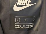 nike black jacket with white nike logo on the back