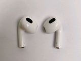two white airpods sitting next to each other on a white surface