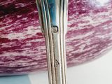 a close up of a spoon and a bowl on a table
