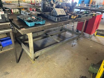 a workbench that has a lot of tools on it