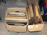 a lot of books in a box on the floor