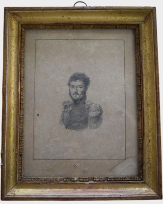 une vieille photo d'un homme barbu dans un cadre en or